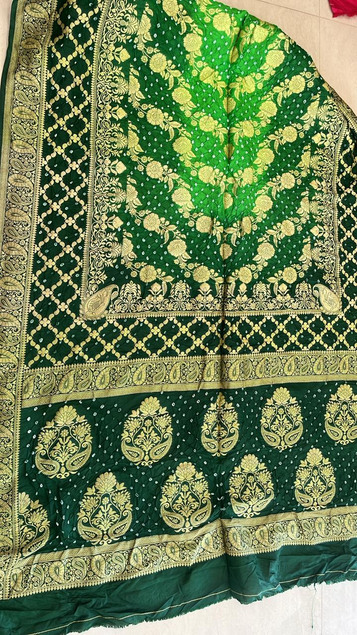 Exquisite Bottle Green Banarasi Bandhani Silk Saree with Rich Gold Zari Border & Flora Buta Meenakshi collection
Fabric : Dupian Silk Sari
Bandini tie and dye from Rajasthan
Benarasi Dupian silk from Varanasi
Stitched blouse
38 to 42 size