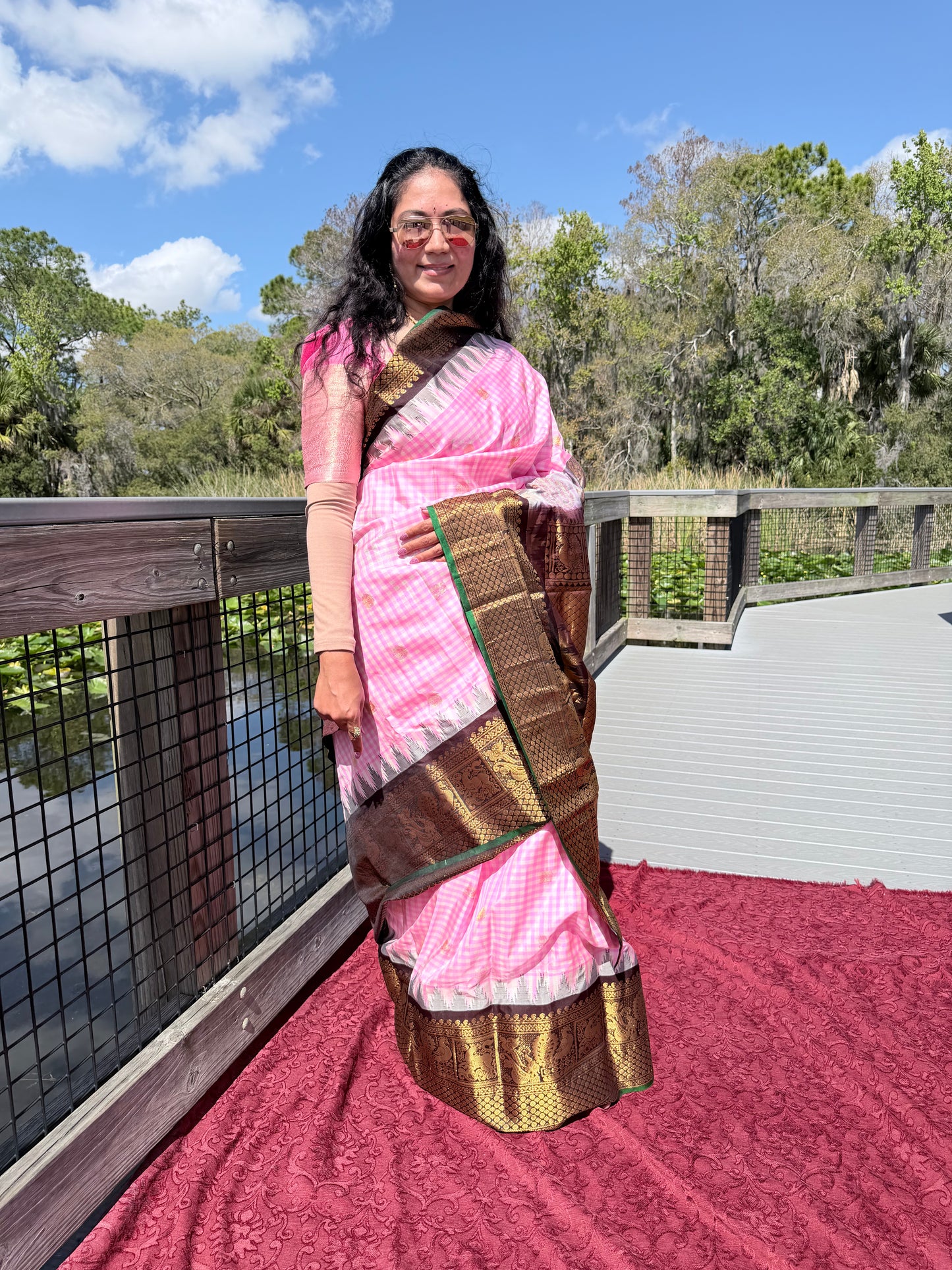 Authentics of Gadwal Pink Checks and zari butta heavy brocade pallu 
Fabric : Pure Silk , pure zari 
Handloom
Sari with blouse stitched to size 38 - 42 inches