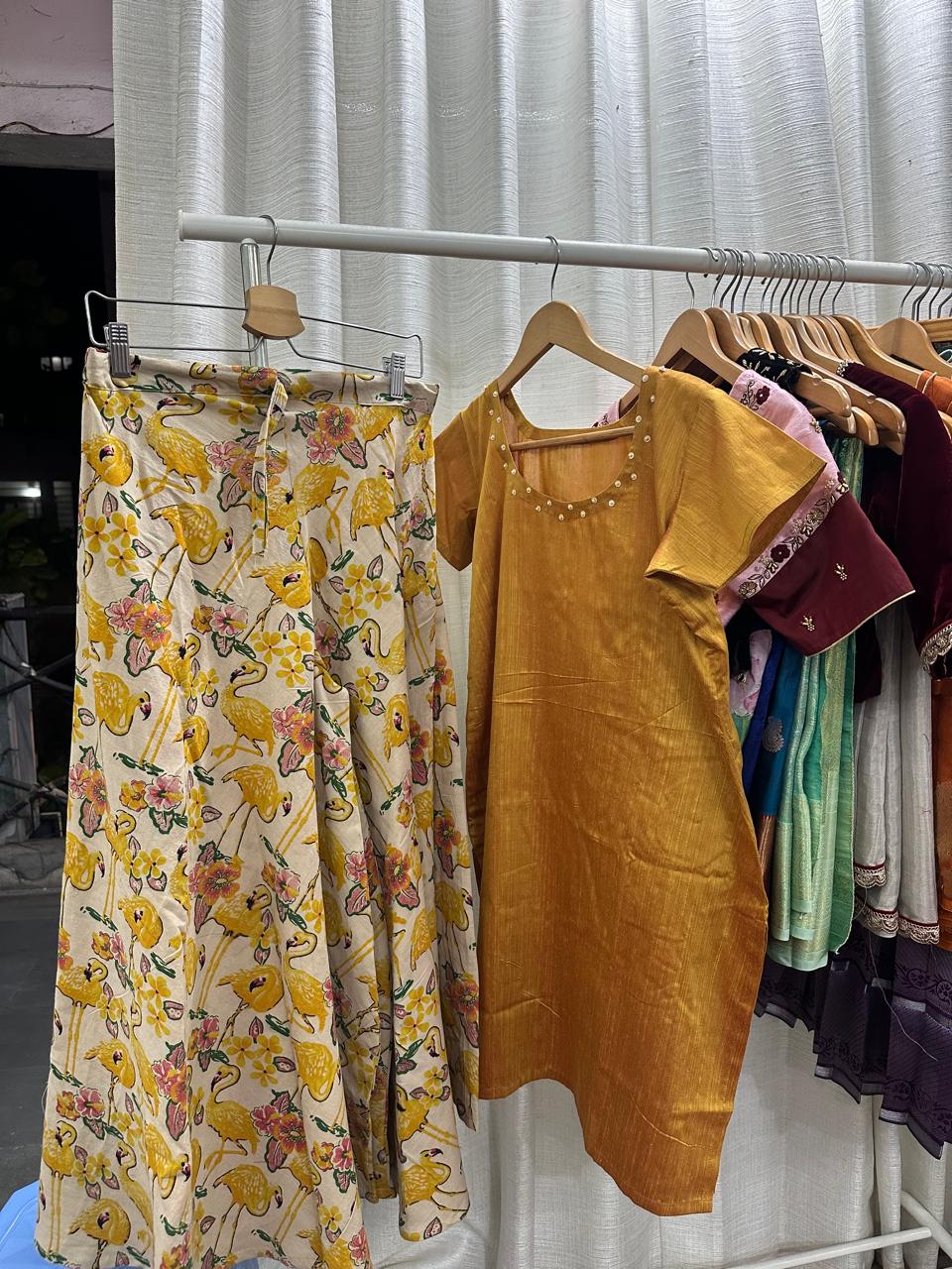 Lavie Premium
Fabric : Kalamkari cotton
Lavie designed this fabric from scratch.
Flamingo screen printed on Kalamkari cotton 
Took 3 months to weave 
Sharara set with had embroidery kurtha